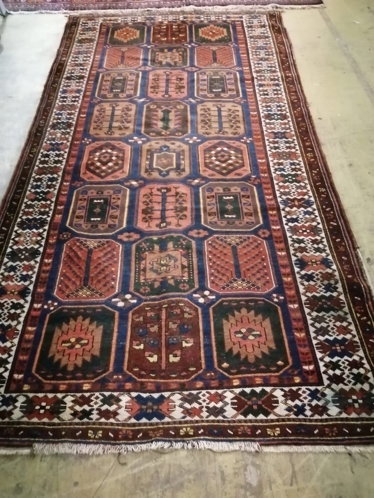 A Caucasian garden design rug, 310 x 160cm